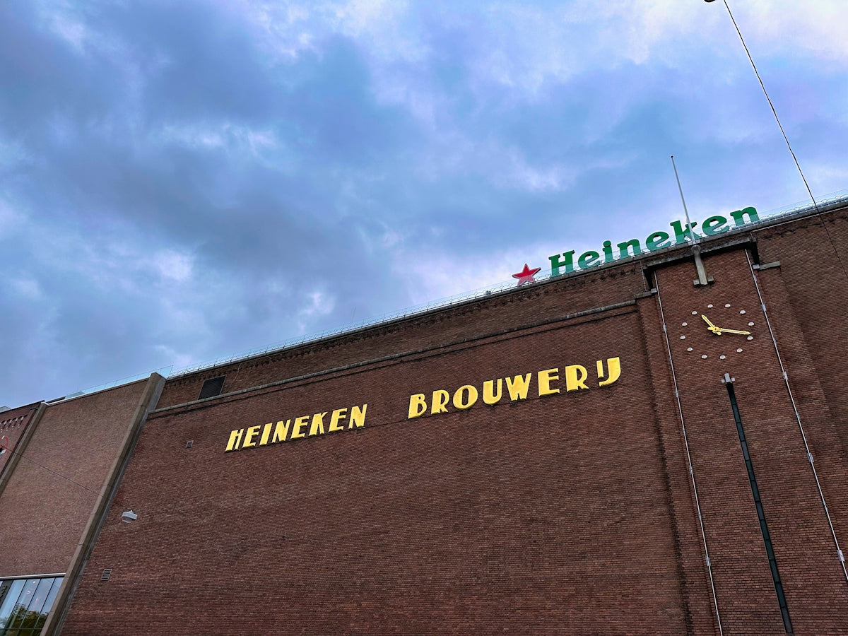 a brick building with a sign on it