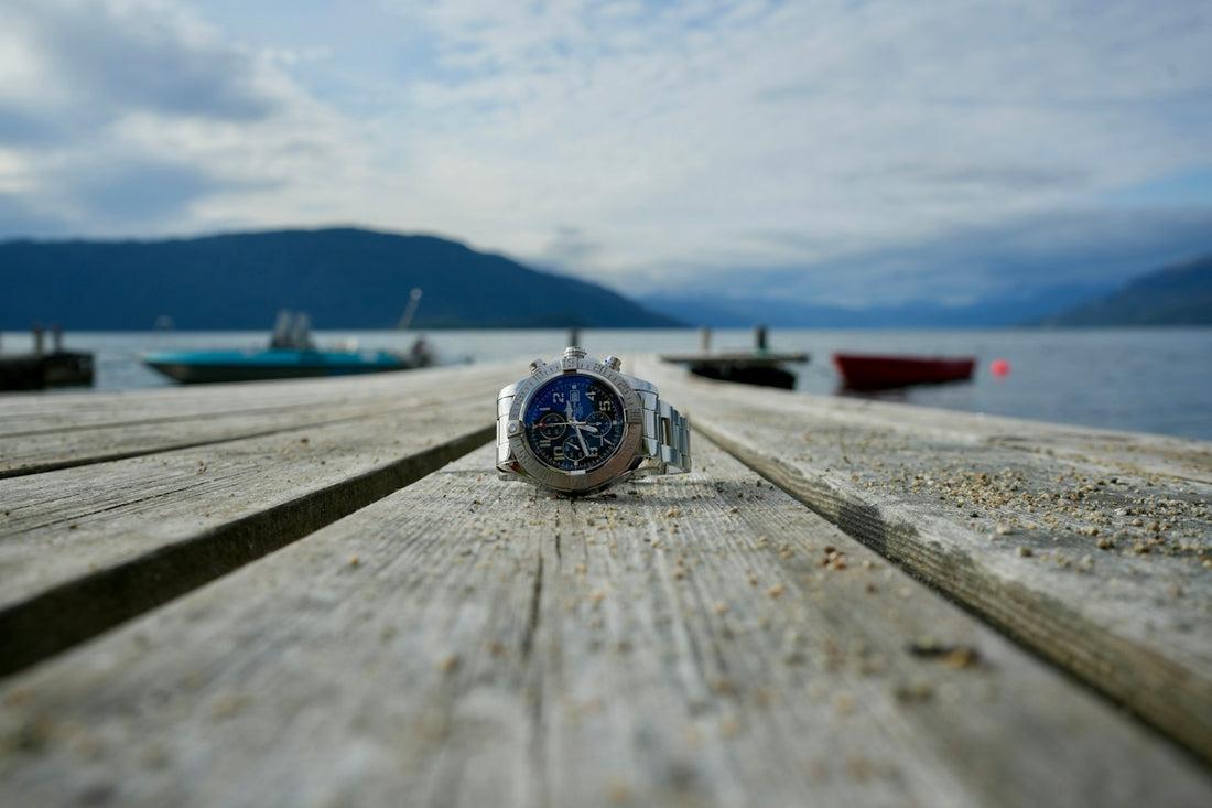 A watch sitting on top of a wooden dock