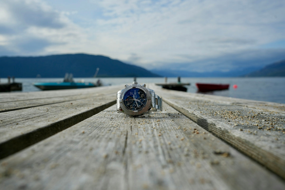 A watch sitting on top of a wooden dock