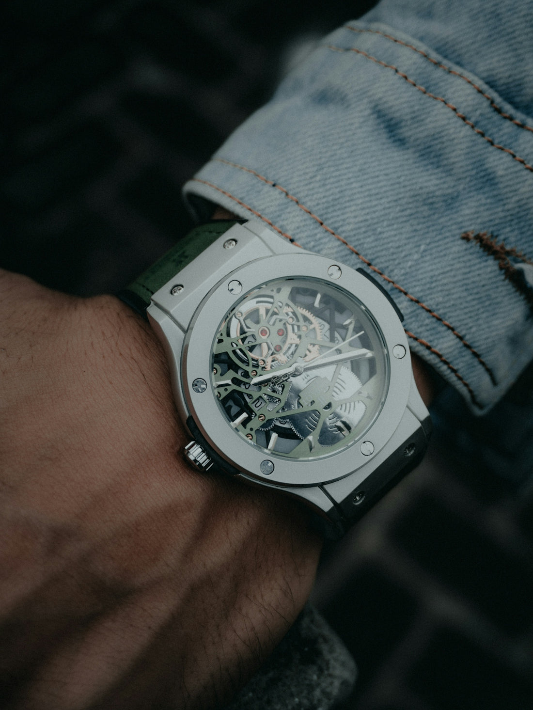 A luxury watch is shown on a wrist