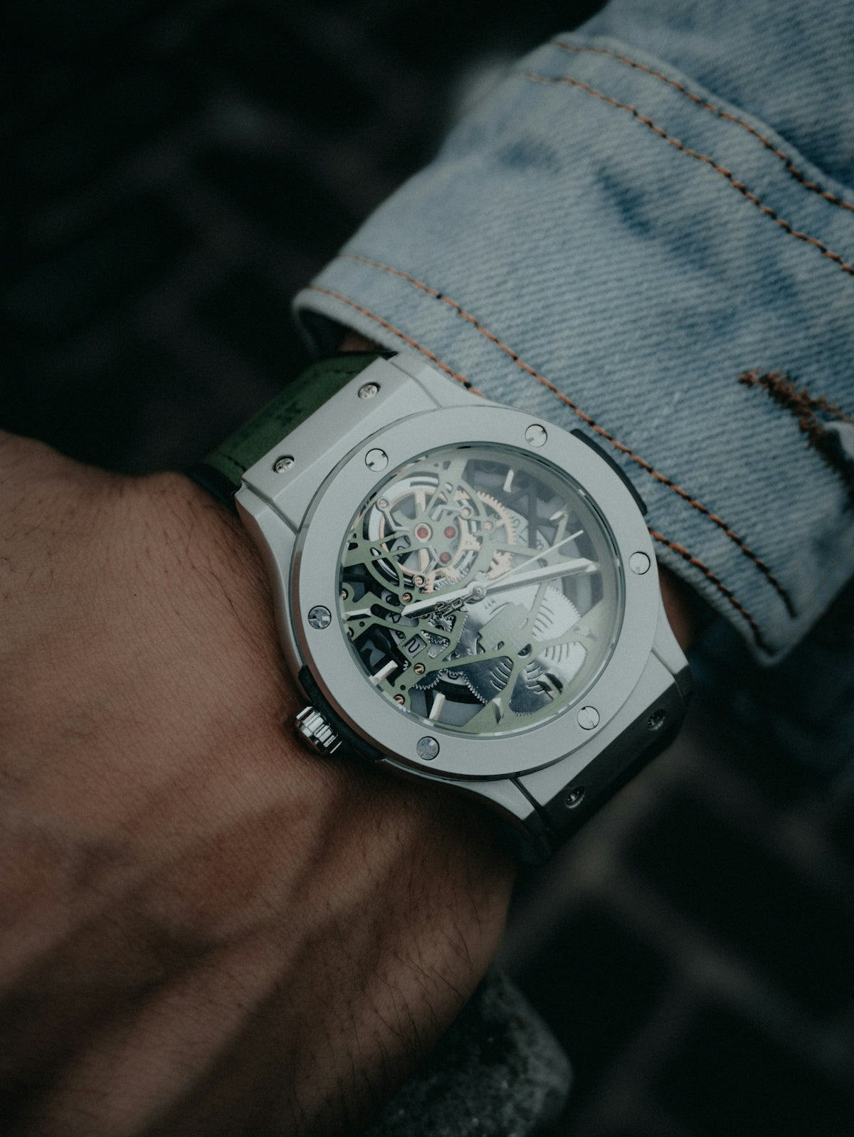 A luxury watch is shown on a wrist
